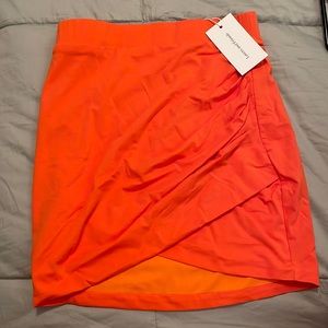 Bright orange tight mini skirt
